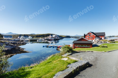 Preview: view on norwegian fjord with houses along coastline