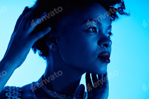 Preview: Striking beauty illuminated by blue light showcases modern elegance and confident style