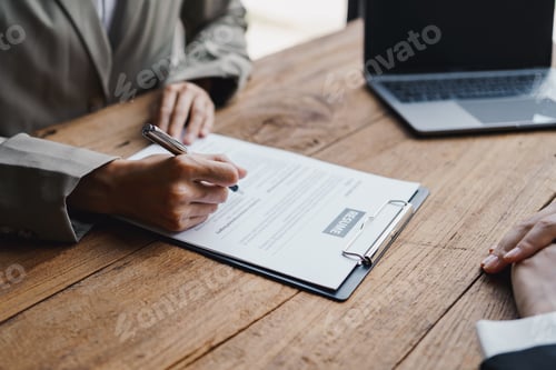 Preview: New graduate woman filling out an application form for HR department Review and review your educatio