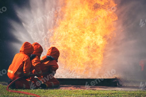 Preview: Firefighter Rescue training in fire fighting extinguisher. Firefighter fighting with flame fire