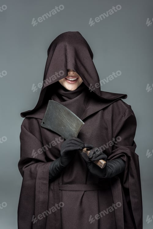 Preview: smiling woman in death costume holding cleaver isolated on grey