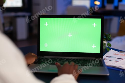 Preview: Black freelancer working on laptop with green screen
