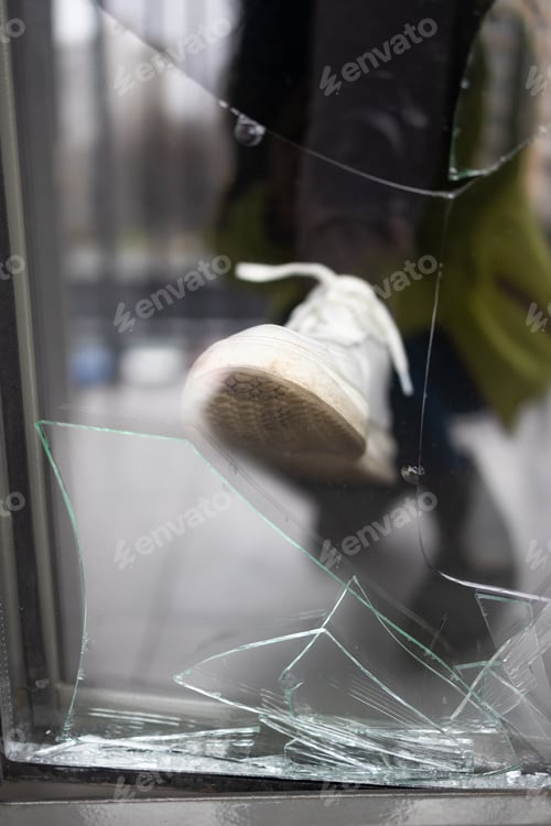 Preview: Broken window pane after vandalism. Door after a burglary.