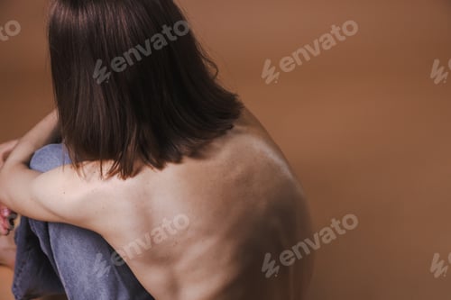 Preview: Woman suffering from anorexia on dark beige background, closeup. Space for text