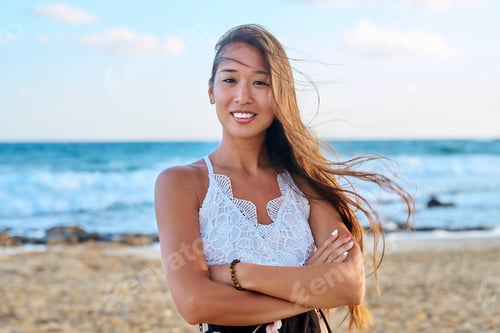 Preview: Outdoor portrait of a happy beautiful young woman, on the sea beach