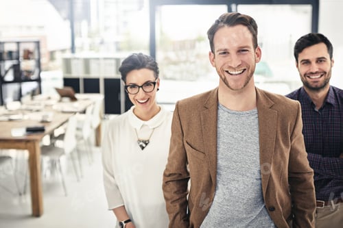 Preview: Portrait of a businessman with his team standing behind him