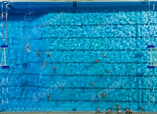 Preview: Aerial drone top view of swimming pool with athletes training water polo
