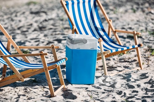 Preview: striped beach chairs and cooler on sand