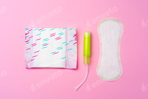 Preview: Female hygienic pad and tampons on pink background