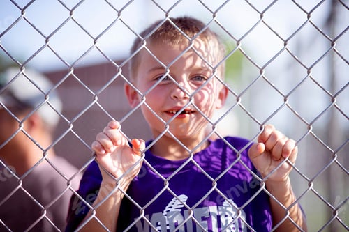 Preview: Hanging out in the face during a little league baseball game, toothless little boy