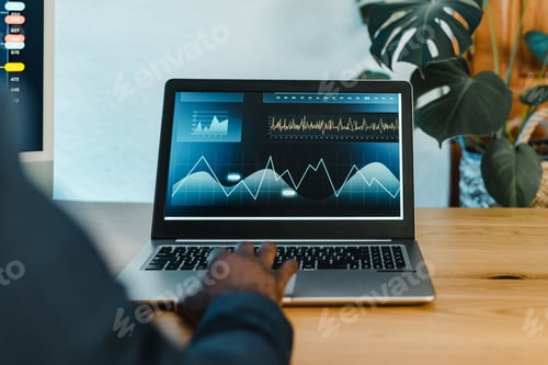 Preview: Crop black businessman typing on laptop