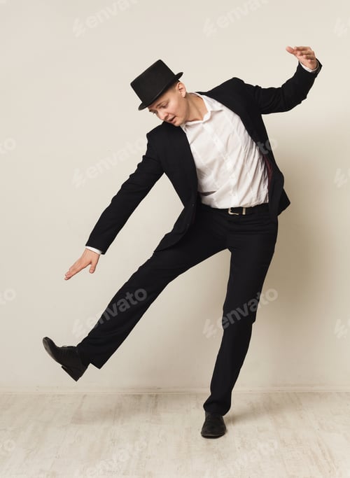 Preview: Portrait Of Young Businessman Playing Marionette, White Studio Background. Business Manipulation