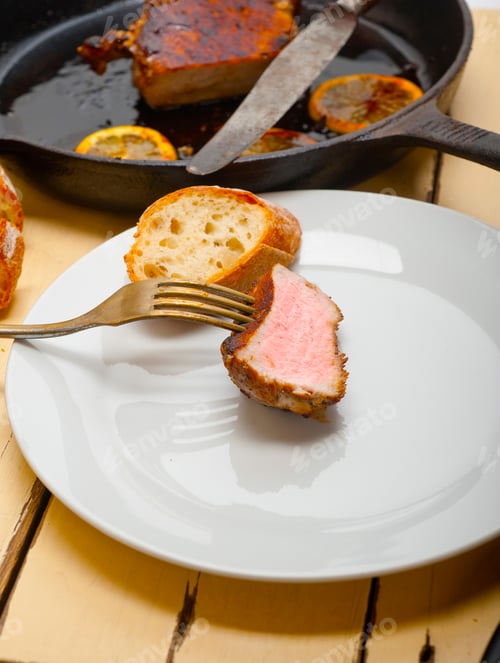 Preview: pork chop seared on iron skillet