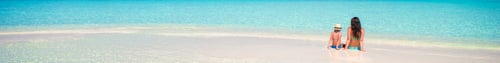 Preview: Little girl and young mother during beach vacation