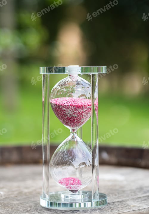 Preview: glass hourglass with pink and white sand
