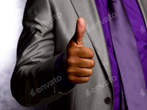 Preview: Business man giving thumbs up