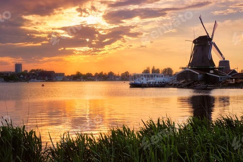 Preview: Windmills at Zaanse Schans in Holland on sunset. Zaandam, Nether