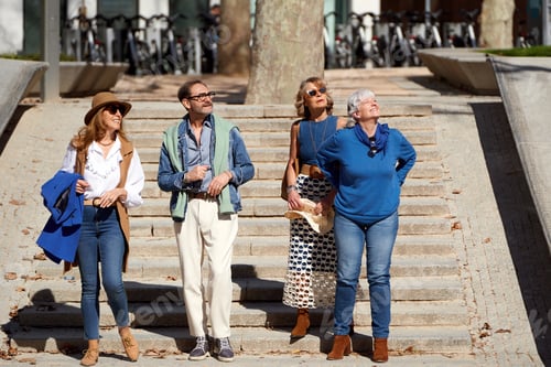 Preview: Senior Friends Enjoying a Leisurely Stroll Through the City