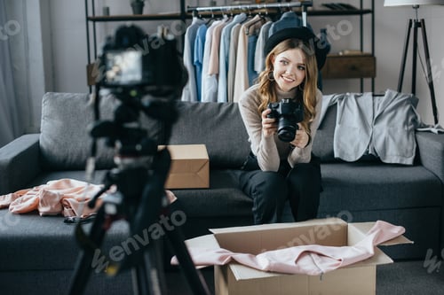 Preview: happy fashion blogger recording new vlog about dress