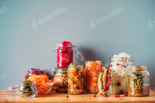 Preview: Probiotics food background. Korean carrot, kimchi, beetroot, sauerkraut, pickled cucumbers in glass