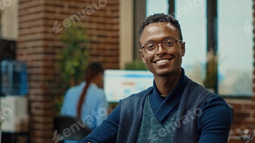 Preview: Startup worker using laptop in office