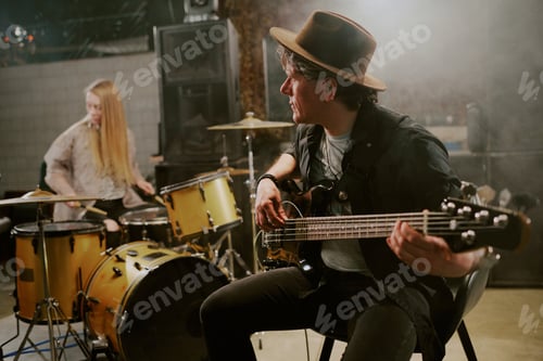 Preview: Band Practicing Music in Dimly Lit Studio