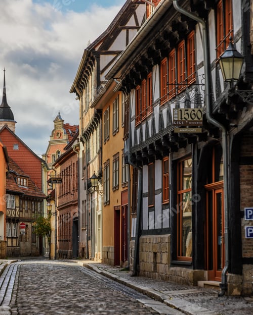Preview: Cobblestone street with historic buildings in Quedlinburg, Germany