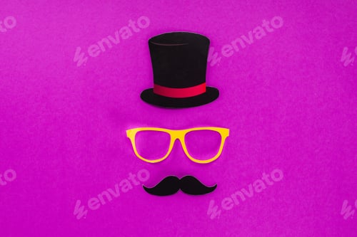 Preview: top view of gentleman face made of cardboard eyeglasses, mustache and hat on pink surface