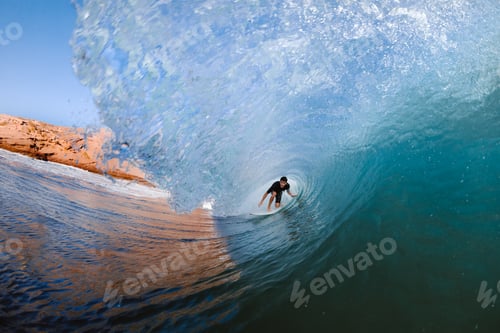 Preview: Surfer practicing surfing on wavy sea with splashing water