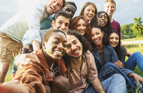 Preview: Cheerful international happy friends having fun taking selfies at picnic