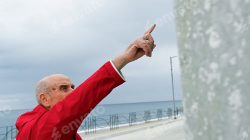 Preview: Old Man Pointing The Finger Up At The Sky