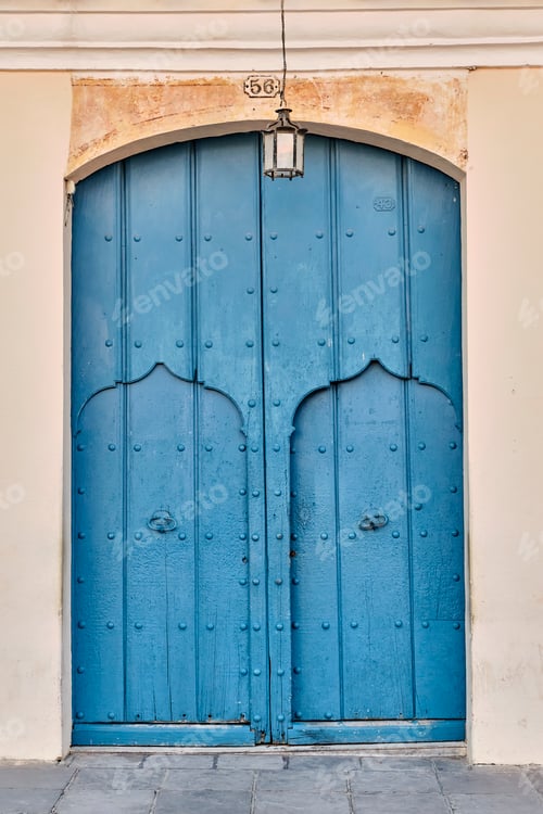 Preview: External blue wooden gates with two doors in building in old colonial city of Trinidad, Cuba.