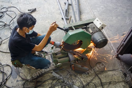 Preview: Welder used grinding stone on steel in factory with sparks