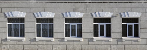 Preview: Texture of a glazed modern windows of a grey concrete building