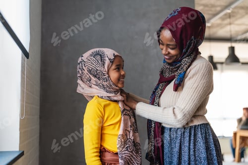 Preview: Muslim single parent. Portrait of a mother and child together at home