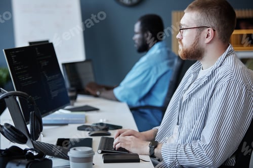 Preview: Coding Team Concentrating on Software Development Project