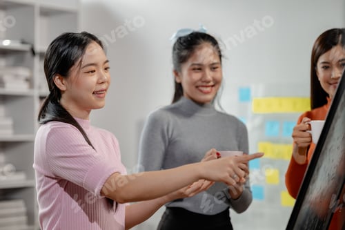 Preview: Attractive businesswoman heads strategy meeting in board room, Happy different aged business team ha