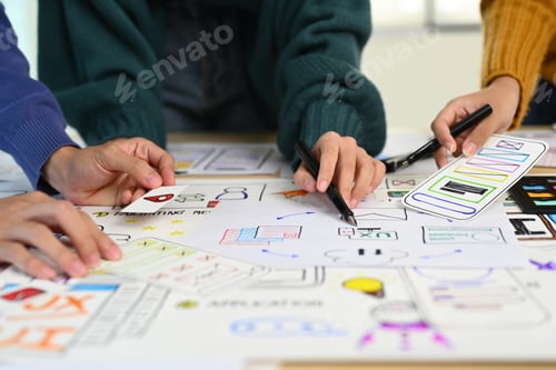 Preview: Male and female creative web designer discussing for mobile application software design project.