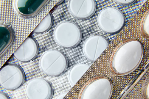 Preview: Flat lay macro blister capsule pills, tablets, top view