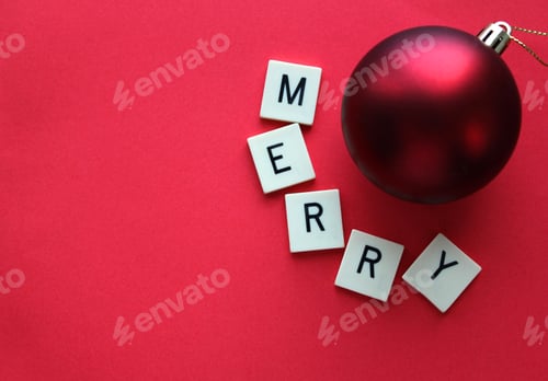 Preview: Christmas bauble with Merry in letters on red background