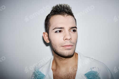 Preview: Non binary man wearing makeup at party