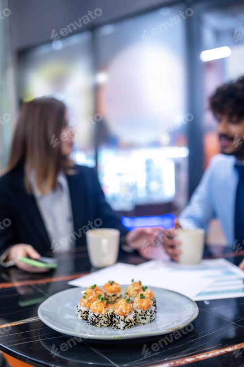 Preview: Colleagues having lunch and talking