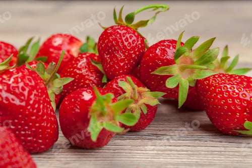 Preview: Red ripe strawberries on wooden table close up