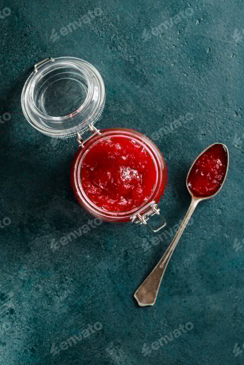 Preview: Top view of strawberry jam in a glass jar
