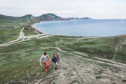 Preview: Boy and girl enjoying a walk along the beach and stunning scenery