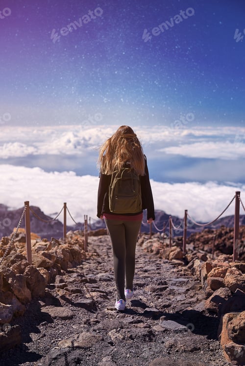 Preview: Young woman hiking the Teide Volcano in Tenerife, Canary Islands, Spain