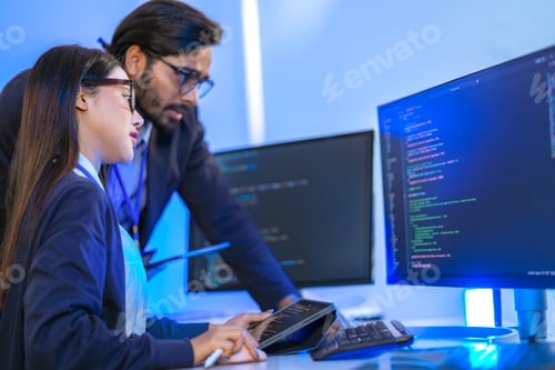 Preview: Senior engineer mentoring a junior female developer.