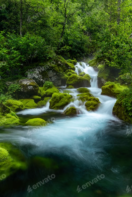 Preview: Landscape waterfall stream on river with mossy rocks and trees in Slovenia