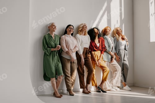 Preview: Multi-ethnic group of mature women bonding and smiling while leaning on the wall together
