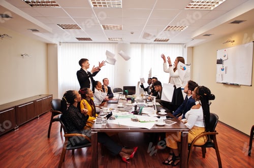 Preview: Multiracial young creative people in modern office